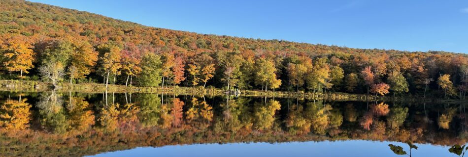 Brilliant fall foliage reflecting in Beecher Lake